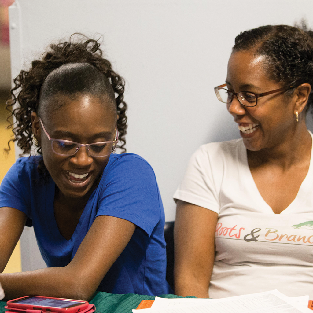 Roots & Branches Image - Staff At The Table