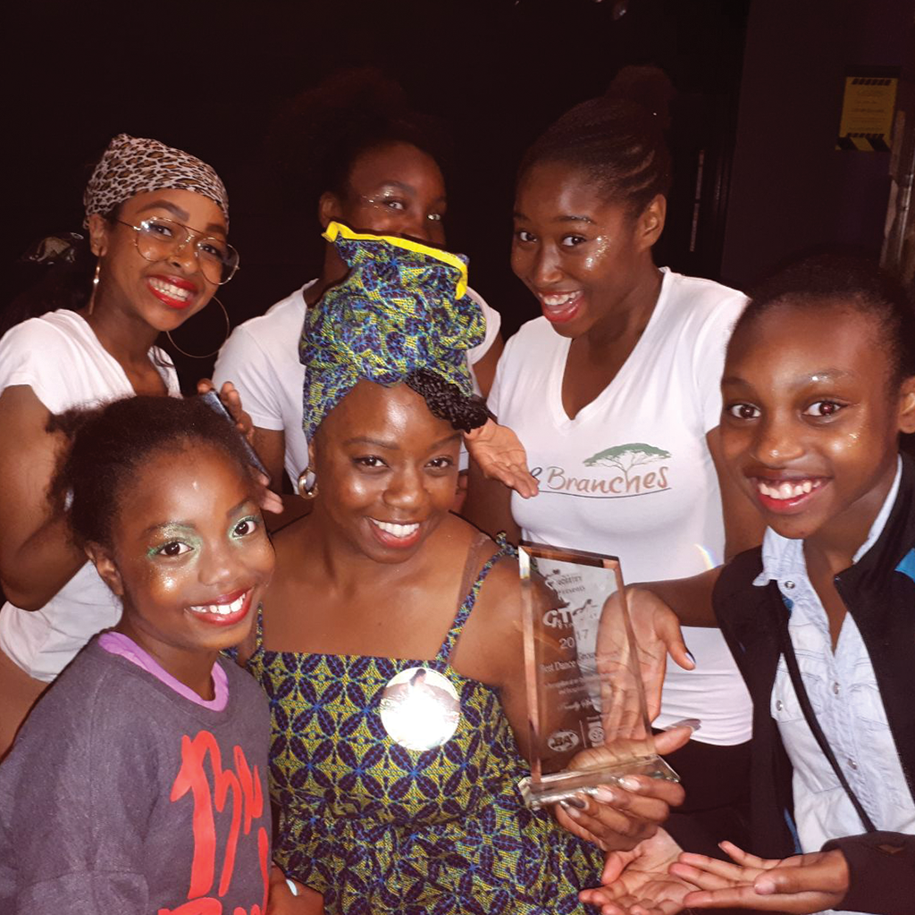 Roots & Branches Image - Tamla and Children With The Award